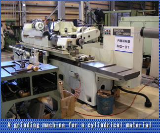A grinding machine for a cylindrical material